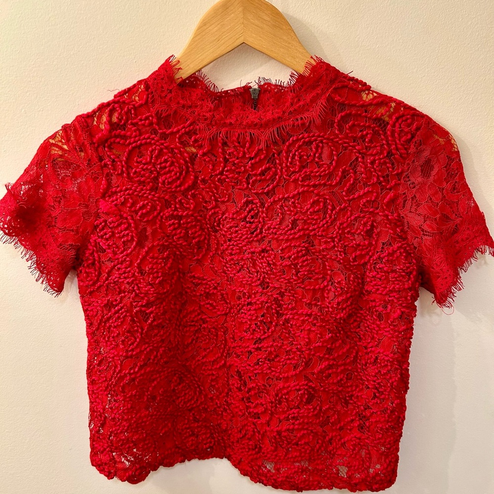 Beautiful red top. It goes nicely with dress pants and skirts as well as jeans.